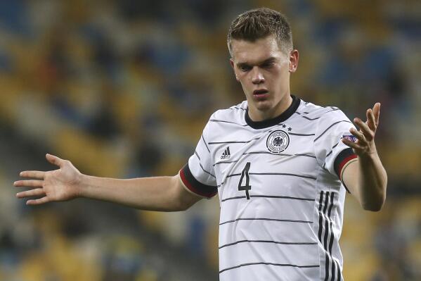 FILE - In this Saturday, Oct.10, 2020 file photo, Germany's Matthias Ginter reacts during the UEFA Nations League soccer match between Ukraine and Germany at the Olimpiyskiy Stadium in Kyiv, Ukraine. Germany's national soccer team coach Hansi Flick has included Barcelona goalkeeper Marc-Andre ter Stegen and Borussia Mönchengladbach defender Matthias Ginter to the Germany squad for its upcoming World Cup qualifiers against Romania and North Macedonia. (AP Photo/Efrem Lukatsky, File)