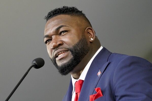 FILE - Hall of Fame inductee David Ortiz speaks during the National Baseball Hall of Fame induction ceremony, Sunday, July 24, 2022, in Cooperstown, N.Y. Ortiz has watched his former team, the Boston Red Sox, stumble to consecutive last-place finishes in three of the past four seasons. Now he believes his old teammate and recently hired Chief Baseball Officer, Craig Breslow, can turn things around. (AP Photo/John Minchillo, File)