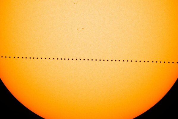 In this composite image provided by NASA, the planet Mercury passes directly between the sun and Earth on May 9, 2016 in a transit which lasted seven-and-a-half-hours. On Monday, Nov. 11, 2019, Mercury will make another transit, visible from the eastern U.S. and Canada, and all Central and South America. The rest of North America, Europe and Africa will catch part of the action. Asia and Australia will miss out. (NASA's Goddard Space Flight Center/SDO/Genna Duberstein via AP)