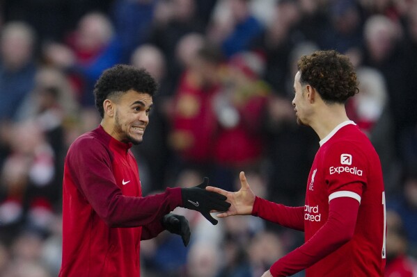 Liverpool's Luis Diaz, left, and Liverpool's Curtis Jones celebrate at the end of the English Premier League soccer match between Liverpool and Burnley, at Anfield stadium in Liverpool, England, Saturday, Feb. 10, 2024. (APPhoto/Jon Super)