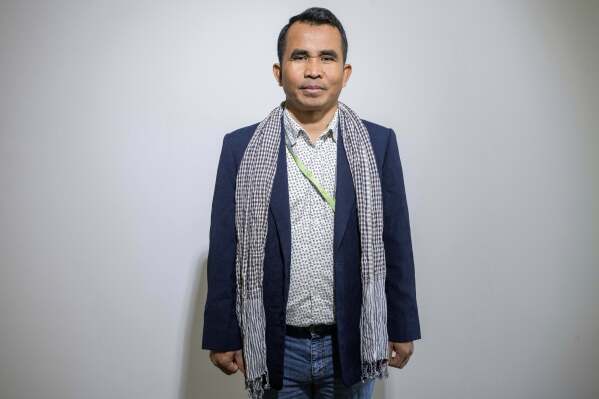 Hour Hum, a Cambodian reporter at Radio Free Asia who spent 7 years in a Thai refugee camp before arriving in the United States, poses for a portrait, Tuesday, April 1, 2025, at the RFA office in Washington. (AP Photo/Rod Lamkey, Jr.)