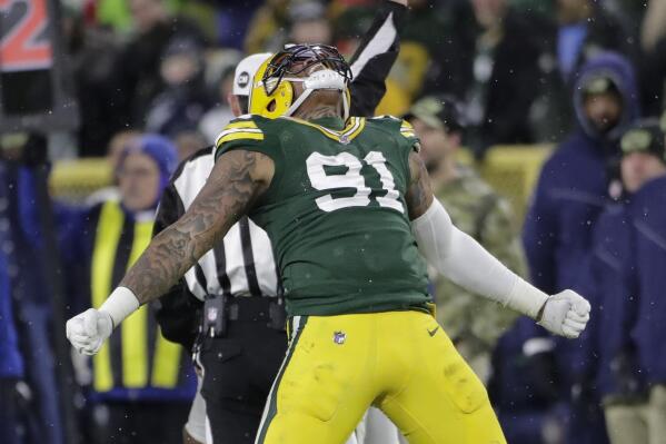 Green Bay Packers' Preston Smith reacts after his sack of Seattle Seahawks' Russell Wilson during the second half of an NFL football game Sunday, Nov. 14, 2021, in Green Bay, Wis. The Packers won 17-0. (AP Photo/Aaron Gash)