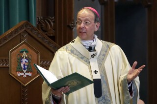 FILE - Baltimore Archbishop William Lori leads a funeral Mass in Baltimore on March 28, 2017. The Catholic Archdiocese of Baltimore announced Friday, Sept. 29, 2023, it filed for Chapter 11 reorganization days before a new state law goes into effect removing the statute of limitations on child sex abuse claims and allowing victims to sue their abusers decades after the fact. (AP Photo/Patrick Semansky, File)