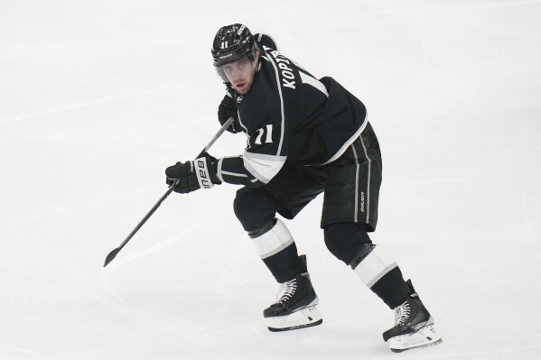 FILE - Los Angeles Kings' Anze Kopitar skates during the first period of an NHL hockey game against the New York Islanders, March 14, 2023, in Los Angeles. The Los Kings have built a roster capable of competing for a Pacific Division title along with a solid core of veterans and youngsters. (AP Photo/Jae C. Hong, File)