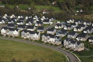 File - Homes in Middlesex Township, Pa., are shown on Apr. 19, 2023. On Thursday, Feb. 1, 2024, Freddie Mac reports on this week's average U.S. mortgage rates. (AP Photo/Gene J. Puskar, File)