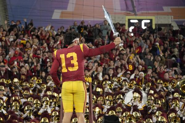 Southern California quarterback Caleb Williams leads the USC Marching Band after USC defeat UCLA 48-45 in an NCAA college football game Saturday, Nov. 19, 2022, in Pasadena, Calif. (AP Photo/Mark J. Terrill)