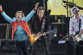 FILE - Mick Jagger, left, Ronnie Wood, center, and Keith Richards, right, of the band "The Rolling Stones," perform onstage during the last concert of their "Sixty" European tour in Berlin, Germany, Aug. 3, 2022. On Monday, Sept. 4, 2023, the Rolling Stones announced they will release their first album of original material in 18 years. Titled “Hackney Diamonds,” the legendary rock band will reveal the full details on Wednesday, Sept. 6, at an event in Hackney in East London. (AP Photo/Michael Sohn, File)