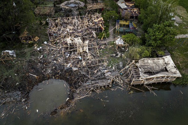 Destroyed resort compound is seen from above after a Russian rocket attack near Kharkiv, Ukraine, Sunday, May 19, 2024. According to officials, several people were killed in this attack. (AP Photo/Evgeniy Maloletka)