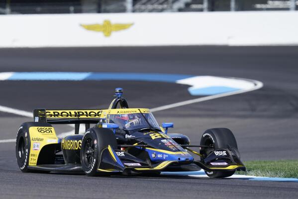 Colton Herta drives into a turn during a practice session for a IndyCar auto race at Indianapolis Motor Speedway, Friday, July 29, 2022, in Indianapolis. (AP Photo/Darron Cummings)