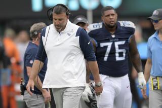 Tennessee Titans head coach Mike Vrabel walks the field after offensive guard Rodger Saffold (76) sustains an apparent injury during the second half of an NFL football game against the New York Jets, Sunday, Oct. 3, 2021, in East Rutherford, N.J. (AP Photo/Bill Kostroun)
