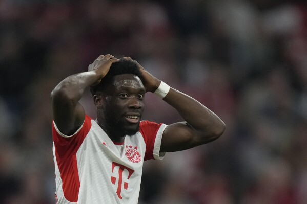 FILE -Bayern's Alphonso Davies reacts during the German Bundesliga soccer match between FC Bayern Munich and SC Freiburg at the Allianz Arena stadium in Munich, Germany, Oct. 8, 2023. Bayern Munich sports director Max Eberl says the club has made its final offer to Canada left back Alphonso Davies to extend his contract amid reported interest from Real Madrid. Eberl tells the Sport Bild magazine, “I can say we made Alphonso a very concrete, appreciative offer. At some point in life you have to say yes or no.” (AP Photo/Matthias Schrader, File)