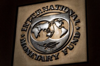 FILE - The logo of the International Monetary Fund is visible on its building, April 5, 2021, in Washington. The IMF slammed Pakistan’s government on Thursday, June 15, 2023, over its proposal for the new annual budget, saying it failed to implement a more fair tax system in the draft. (AP Photo/Andrew Harnik, File)