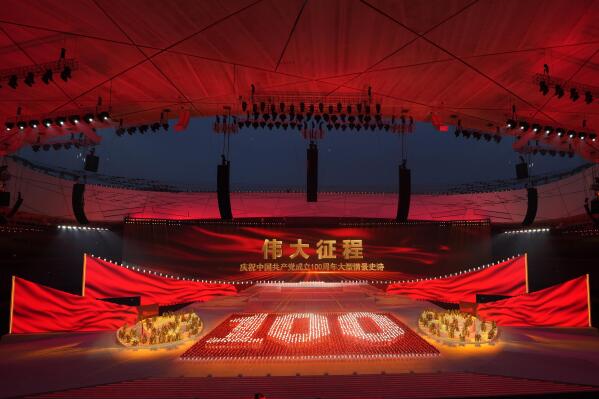 Performers form the number 100 at a gala show ahead of the 100th anniversary of the founding of the Chinese Communist Party in Beijing on Monday, June 28, 2021. For China's Communist Party, celebrating its 100th birthday on Thursday, July 1 is not just about glorifying its past. It's also about cementing its future and that of its leader, Chinese President Xi Jinping. (AP Photo/Ng Han Guan)