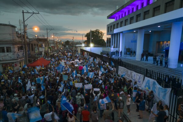 Demonstrators gather in front of the attorney general's office building to show their support for the election process and going forward with a presidential runoff election in Guatemala City, Saturday, July 15, 2023. (AP Photo/Moises Castillo)