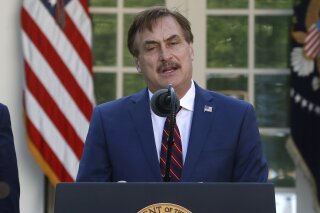 FILE - In this March 30, 2020 file photo, My Pillow CEO Mike Lindell speaks in the Rose Garden of the White House in Washington. Dominion Voting Systems filed a $1.3 billion defamation lawsuit Monday, Feb. 22, 2021, against Lindell, the founder and CEO of Minnesota-based MyPillow, saying that Lindell falsely accused the company of rigging the 2020 presidential election. (AP Photo/Alex Brandon File)