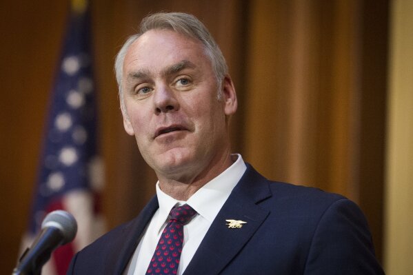 
              FILE - In this Dec. 11, 2018 file photo, Secretary of the Interior Ryan Zinke speaks after an order withdrawing federal protections for countless waterways and wetland was signed, at EPA headquarters in Washington.  Trump says on Saturday, Dec. 15,  Zinke leaving administration at end of year, successor to be announced next week.(AP Photo/Cliff Owen)
            