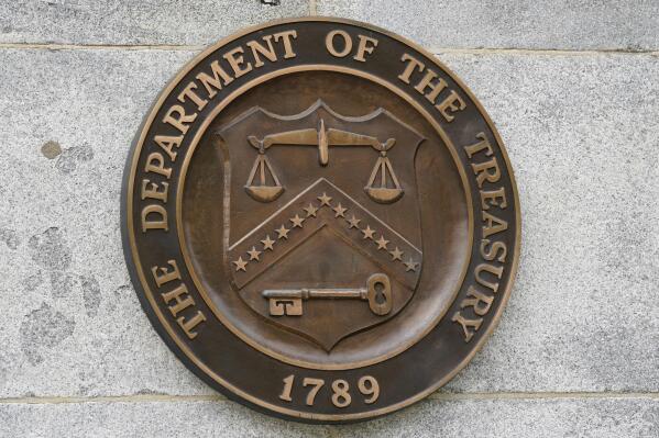 FILE - The Department of the Treasury's seal outside the Treasury Department building in Washington on May 4, 2021. The U.S. on Thursday, June 15, 2023, imposed sanctions on a North Korean husband and wife living in Beijing accused of helping to procure equipment for ballistic missiles that ended up in the hands of North Korean and Iranian customers. (AP Photo/Patrick Semansky, File)