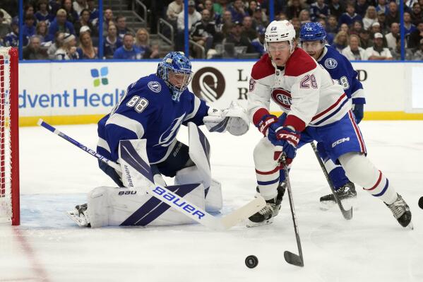 Tampa Bay Lightning goaltender Andrei Vasilevskiy (88) makes a save on a shot by Montreal Canadiens center Christian Dvorak (28) during the first period of an NHL hockey game Wednesday, Dec. 28, 2022, in Tampa, Fla. (AP Photo/Chris O'Meara)