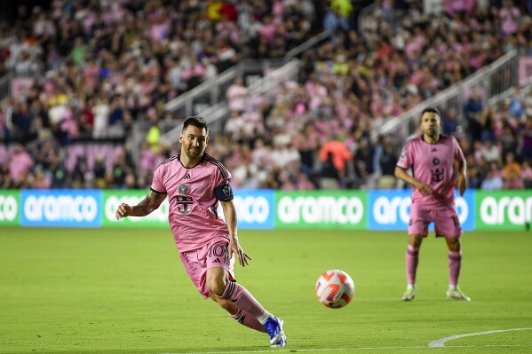 Inter Miami forward Lionel Messi chases the ball after a penalty kick during the first half of a CONCACAF Champions Cup soccer match against Nashville SC, Wednesday, March 13, 2024, in Fort Lauderdale, Fla. (AP Photo/Michael Laughlin)