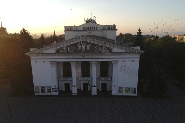 The Donetsk Academic Regional Drama Theatre in Mariupol, Ukraine, stands as the sun rises on June 27, 2019. Amid all the horrors that have unfolded in the war in Ukraine, the Russian airstrike on the theater, used as a bomb shelter, on March 16, ​2022, stands out as the single deadliest known attack against civilians to date. (Lev Sandalov via AP)