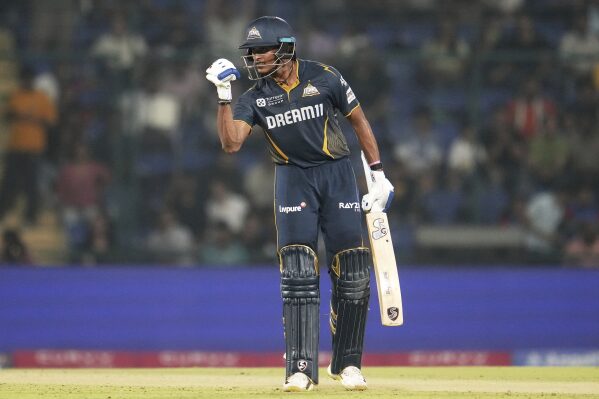 Gujarat Titans' Sai Sudharsan celebrates after scoring a century during the Indian Premier League cricket match between Delhi Capitals and Gujarat Titans at Arun Jaitley Stadium in New Delhi, India, Monday, May 19, 2025. (AP Photo/Manish Swarup)