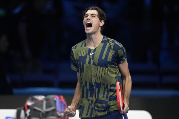 United States' Taylor Fritz celebrates after winning against Canada's Felix Auger-Aliassime during their singles tennis match of the ATP World Tour Finals, at the Pala Alpitour in Turin, Italy, Thursday, Nov. 17, 2022. (AP Photo/Antonio Calanni)
