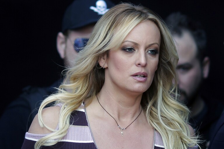 FILE - Stormy Daniels arrives at an event in Berlin, on Oct. 11, 2018. The porn actor received a $130,000 payment from Donald Trump's former lawyer Michael Cohen as part of his hush-money efforts. Cohen paid Daniels to keep quiet about what she says was a sexual encounter with Trump years earlier. Trump denies having sex with Daniels. (AP Photo/Markus Schreiber, File)
