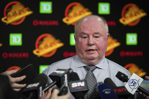 Vancouver Canucks coach Bruce Boudreau responds to questions during a news conference after the team's NHL hockey game against the Edmonton Oilers on Saturday, Jan. 21, 2023, in Vancouver, British Columbia. (Darryl Dyck/The Canadian Press via AP)