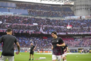 FILE - Newcastle's Sandro Tonali warms up prior to the start of the Champions League group F soccer match between AC Milan and Newcastle at the San Siro stadium in Milan, Italy, Tuesday, Sept. 19, 2023. AC Milan took the first formal step Wednesday, Sept. 27, to moving away from the iconic San Siro, which it shares with Inter Milan, and building a new stadium in the southern part of the city. The Rossoneri announced they had filed a proposal to the council in San Donato to build a 70,000-seater stadium in the city suburb. (AP Photo/Antonio Calanni, File)