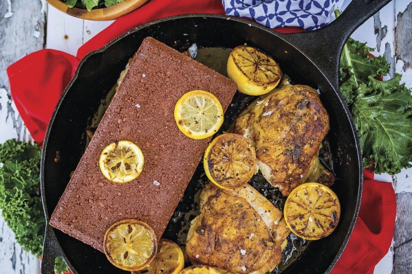 This image released by Ulysses Press shows a recipe for chicken under a brick. This recipe is fast and easy, and will add some victory points to your cooking game. It is gluten-free, sugar-free, dairy-free and low-fat. (Allyson Reedy and Greg McBoat/Ulysses Press via AP)