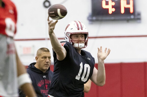 Wisconsin quarterback Tyler Van Dyke (10) passes during spring NCAA college football practice at the McClain Center in Madison, Wisc., Thursday, April 4, 2024.(Samantha Madar/Wisconsin State Journal via AP)