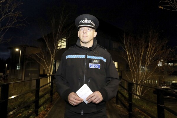 Superintendent Owain Llewelyn at North Wales Police St Asaph Dhq speaks to the media in St. Asaph, Wales, Tuesday, Nov. 21, 2023, about the search for Jevon Hirst, Harvey Owen, Wilf Henderson, and Hugo Morris. British police said Tuesday the bodies of the four teenage boys who had been missing since they left for a weekend camping trip have been found inside their overturned car near Tremadog in Gwynedd. The vehicle was found partially submerged in water and the deaths appeared to be the result of an accident. (Ian Cooper/PA via AP)