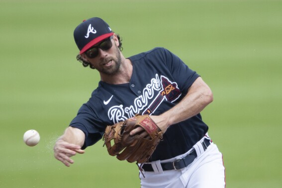FILE - Atlanta Braves' Charlie Culberson throws to first after fielding a ground ball during a practice baseball game, Thursday, July 9, 2020, in Atlanta. The Atlanta Braves designated infielder Culberson for assignment hours before his father was set to throw out a ceremonial first pitch on Father's Day, Sunday, June 18, 2023. (AP Photo/John Bazemore, File)