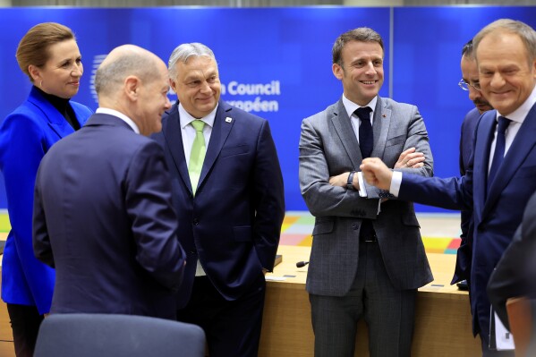 From left, Denmark's Prime Minister Mette Frederiksen, Germany's Chancellor Olaf Scholz, Hungary's Prime Minister Viktor Orban, French President Emmanuel Macron and Poland's Prime Minister Donald Tusk during a round table meeting at an EU Summit in Brussels, Thursday, March 21, 2024. European Union leaders are gathering to consider new ways to help boost arms and ammunition production for Ukraine. Leaders will also discuss in Thursday's summit the war in Gaza amid deep concern about Israeli plans to launch a ground offensive in the city of Rafah. (AP Photo/Geert Vanden Wijngaert)