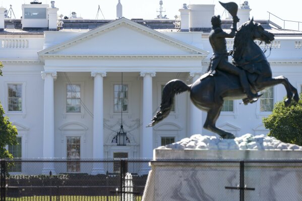 A statue of former president Andrew Jackson is seen inside a closed Lafayette Park, Thursday, Oct. 8, 2020, in front of the White House in Washington. (AP Photo/Jacquelyn Martin)