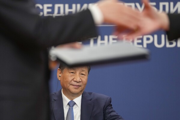 FILE - Chinese President Xi Jinping looks on as documents are exchanged after the signing of an agreement at the Serbia Palace, in Belgrade, Serbia, Wednesday, May 8, 2024. Most countries in the European Union are making efforts to “de-risk” their economies from perceived threats posed by China. But Hungary and Serbia have gone in the other direction. They are courting major Chinese investments in the belief that the world’s second-largest economy is essential for Europe’s future. (AP Photo/Darko Vojinovic, File)