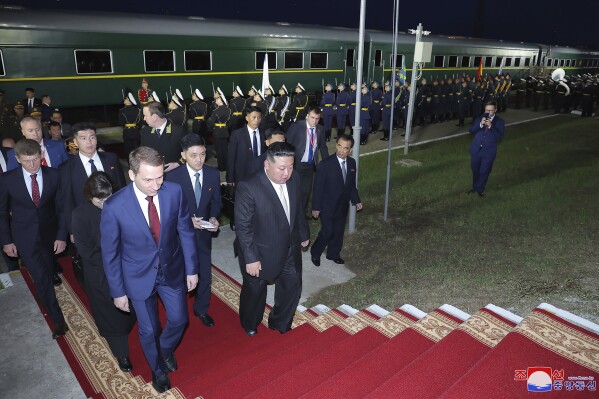 In this photo provided by the North Korean government, North Korea leader Kim Jong Un, front right, and Russian Natural Resources Minister Alexander Kozlov, front left, walk to a station building at Khasan station, Russia Tuesday, Sept. 12, 2023. Independent journalists were not given access to cover the event depicted in this image distributed by the North Korean government. The content of this image is as provided and cannot be independently verified. Korean language watermark on image as provided by source reads: "KCNA" which is the abbreviation for Korean Central News Agency. (Korean Central News Agency/Korea News Service via AP)