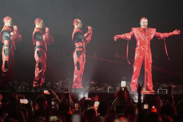 Red Sebastian from Belgium performs the song "Strobe Lights" during the first semi-final of the 69th Eurovision Song Contest, in Basel, Switzerland, Tuesday, May 13, 2025. (AP Photo/Martin Meissner)