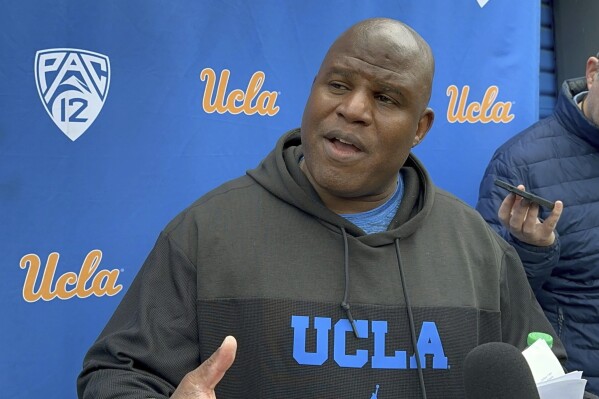 UCLA associate head coach and offensive coordinator Eric Bieniemy speaks with the reporters during an NCAA college football media availability, Thursday, April 4, 2024, in Los Angeles. (AP Photo/Joseph Reedy)