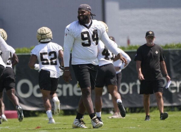 New Orleans Saints defensive end Cameron Jordan (94) walks on the field during an NFL OTA football practice in Metairie, La., June 5, 2024. (AP Photo/Gerald Herbert, File)