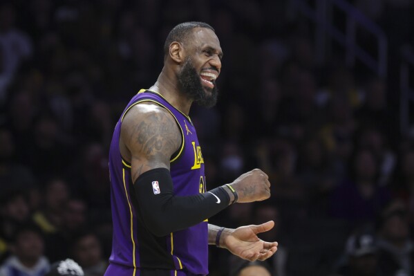 Los Angeles Lakers forward LeBron James (23) celebrates during the second half of the team's NBA basketball game against the New Orleans Pelicans on Friday, Feb. 9, 2024, in Los Angeles. (AP Photo/Yannick Peterhans)