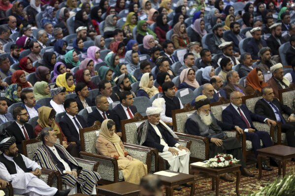 
              Afghan President Ashraf Ghani, center, sits during the first day of the Loya Jirga, or the consultative council in Kabul, Afghanistan, Monday, April 29, 2019. Afghanistan's president opened a grand council on Monday of more than 3,200 prominent Afghans seeking to agree on a common approach to peace talks with the Taliban, but the gathering may further aggravate divisions within the U.S.-backed government. (AP Photo/Rahmat Gul)
            