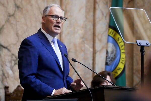 Washington Gov. Jay Inslee delivers his annual State of the State address to a joint legislative session in House chambers at the Washington state Capitol, Tuesday, Jan. 9, 2024, in Olympia, Wash. (AP Photo/Lindsey Wasson)