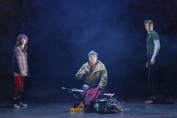 This image released by Polk & Co. shows Alison Jaye, Juan Carlos and Burke Swanson during a performance of "Stranger Things: The First Shadow." (Matthew Murphy and Evan Zimmerman/Polk & Co. via AP)