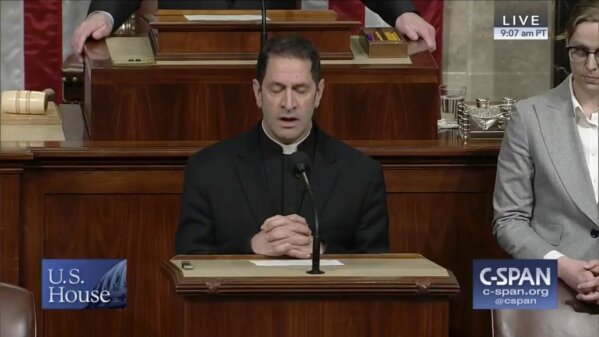 In this image from video made available by C-SPAN, Father Timothy Kesicki, president of the Jesuit Conference of Canada and the United States, delivers a prayer in the House of Representatives on Capitol Hill in Washington on Thursday, April 5, 2018. In 2016, Kesicki had an initial meeting with Joe Stewart, one of more than 1,000 descendants of Isaac Hawkins, an enslaved man who was among those sold by the Jesuits in 1838. “Hearing what it felt like, that the church that baptized him had held his ancestors as slaves -- it’s a life-changing feeling,” Kesicki said. “You can walk away, which is what we’ve done as a country, or you can embrace it.” (C-SPAN via AP)