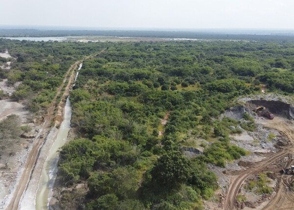 This image taken from video Wednesday, Feb. 19, 2025, shows the path of mine waste in a river near a Sino-Metals Leach Zambia mine near Kitwe. (AP Photo/Richard Kille )