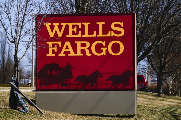File - A Wells Fargo bank sign is shown in Langhorne, Pa., Monday, March 14, 2022. (AP Photo/Matt Rourke, File)