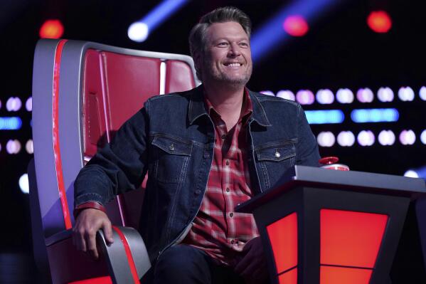 This image released by NBC shows Blake Shelton on the set of "The Voice." Shelton, the last of the original panel of judges on “The Voice,” announced he will leave the U.S. version of the singing competition show after next season. (Tyler Golden/NBC via AP)