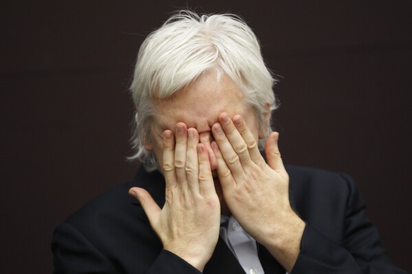 FILE - WikiLeaks founder Julian Assange gestures as he talks during a news conference in central London, on Dec. 1, 2011. Assange faces a key hearing Monday May 20, 2024 in his decade-and-a-half-long attempt to avoid extradition to the United States on espionage charges. (AP Photo/Lefteris Pitarakis, File)