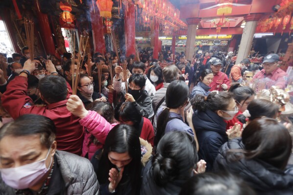 Worshippers go to pray at a temple on the first day of the Lunar New Year celebrations in Taipei, Taiwan, Saturday, Feb. 10, 2024. Each year is named after one of the 12 signs of the Chinese zodiac in a repeating cycle, with this year being the Year of the Dragon. (APPhoto/Chiang Ying-ying)
